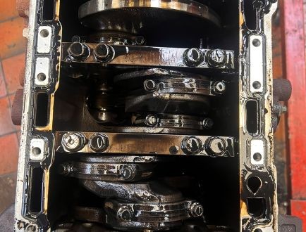 Disassembled engine block showing internal components during engine rebuild