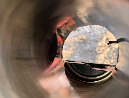 Close-up view inside an engine cylinder during inspection
