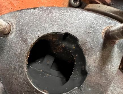 Damaged engine component showing signs of mechanical failure